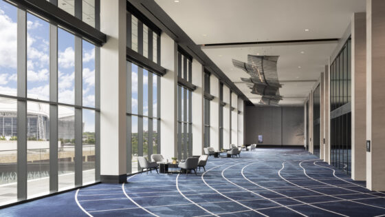 Loews Arlington with blue and white geometric carpet by Brintons