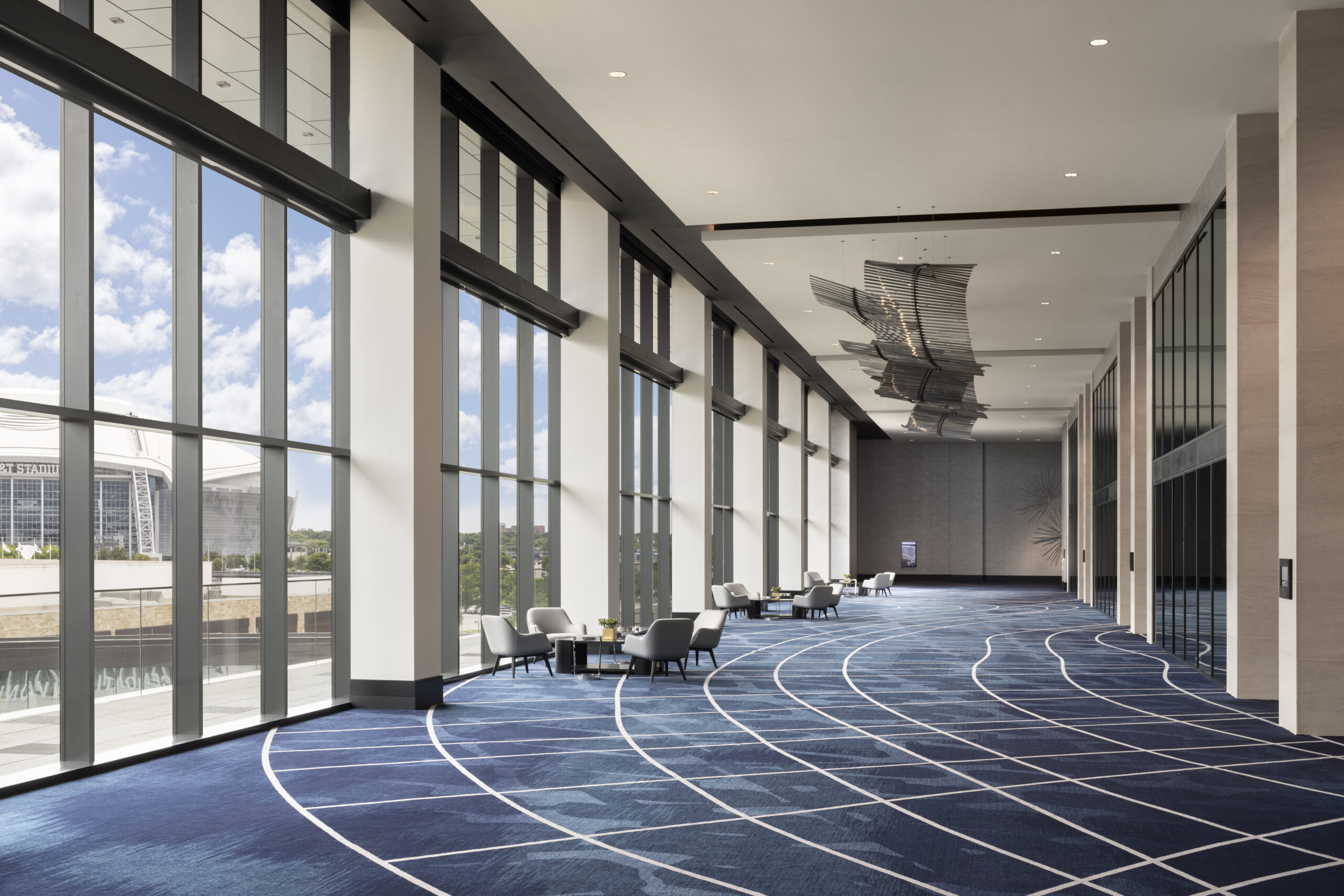 Loews Arlington with blue and white geometric carpet by Brintons