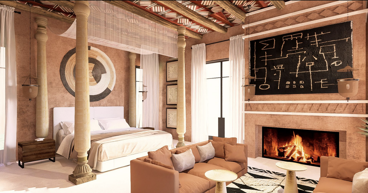 four poster bed, couch and fireplace in Marrakech hotel