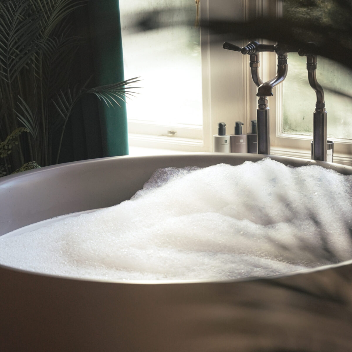 Bubble bath in luxury hotel bathroom