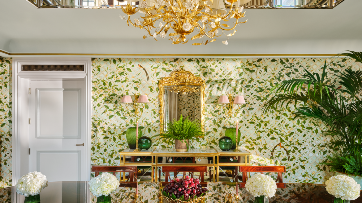 dining room with gold chandelier and garden trellis wallpaper in The dorchester Royal suite