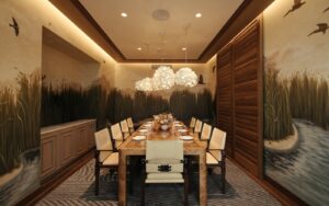 private dining room in The Crossing restaurant which features an immersive custom mural created by Lonesome Pictopia