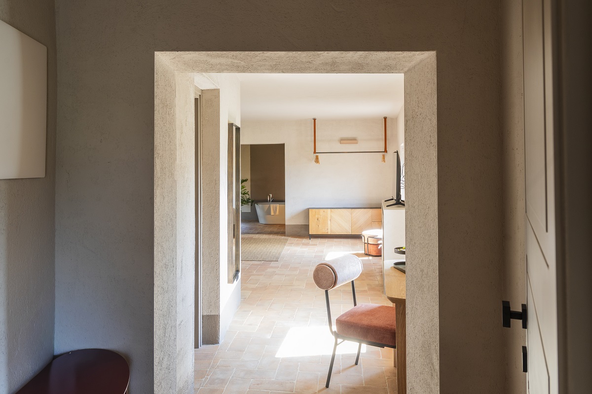 view from corridor into guestroom and through to bathroom in The Monteleone