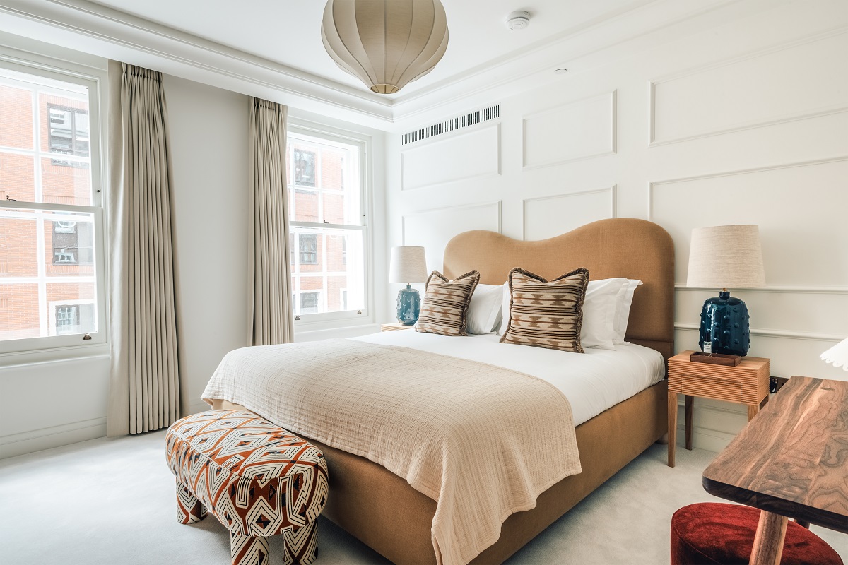 guestroom with bed and bedside table with Hypnos mattress in Claridge House by SLO