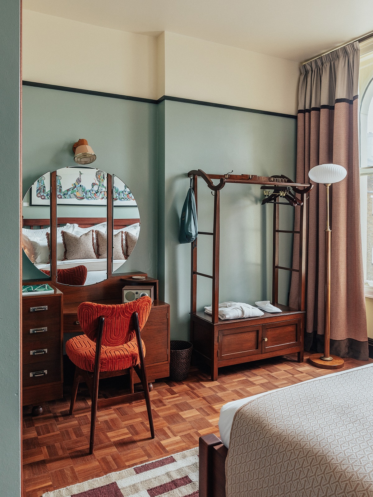 guestroom detail with vintage furniture and parquet flooring