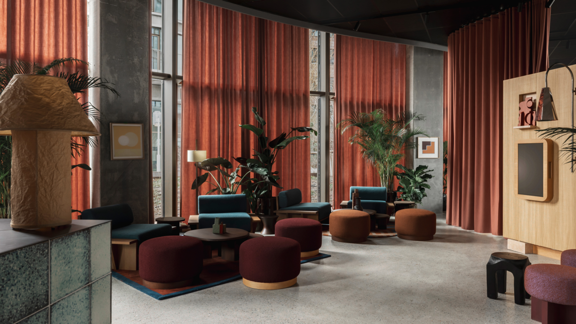 rust and brown seating and curtains in lobby of Locke Copenhagen designed by A-nrd
