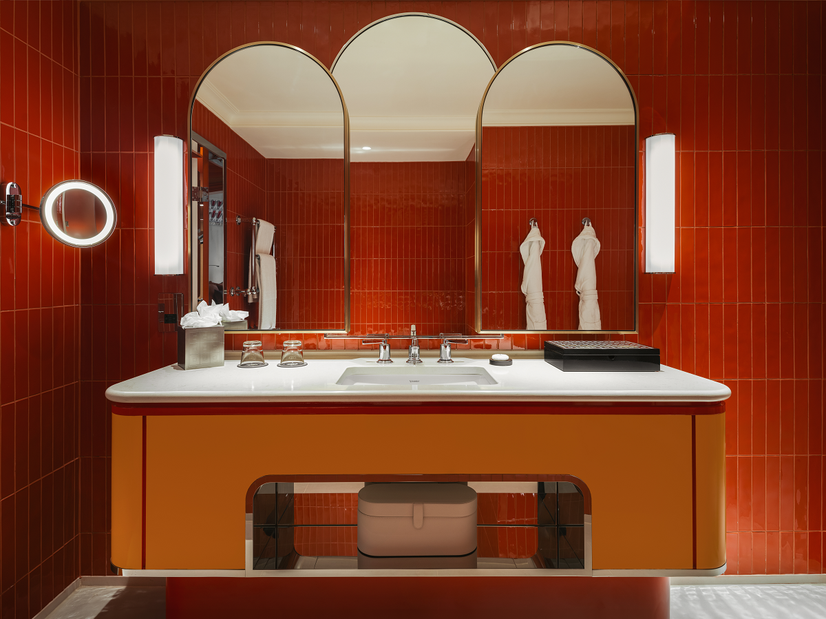 drenched orange bathroom walls and vanity
