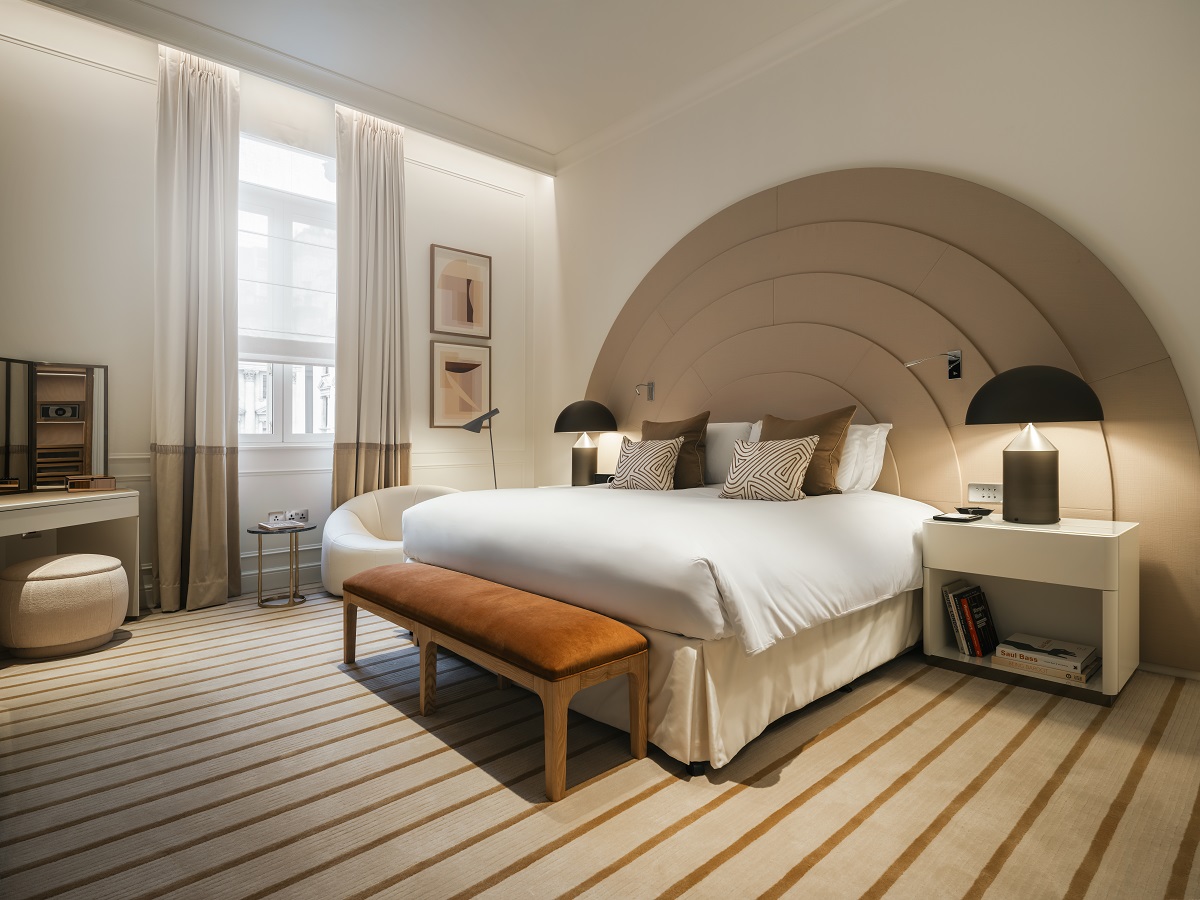 bed with oversized arched bedhead