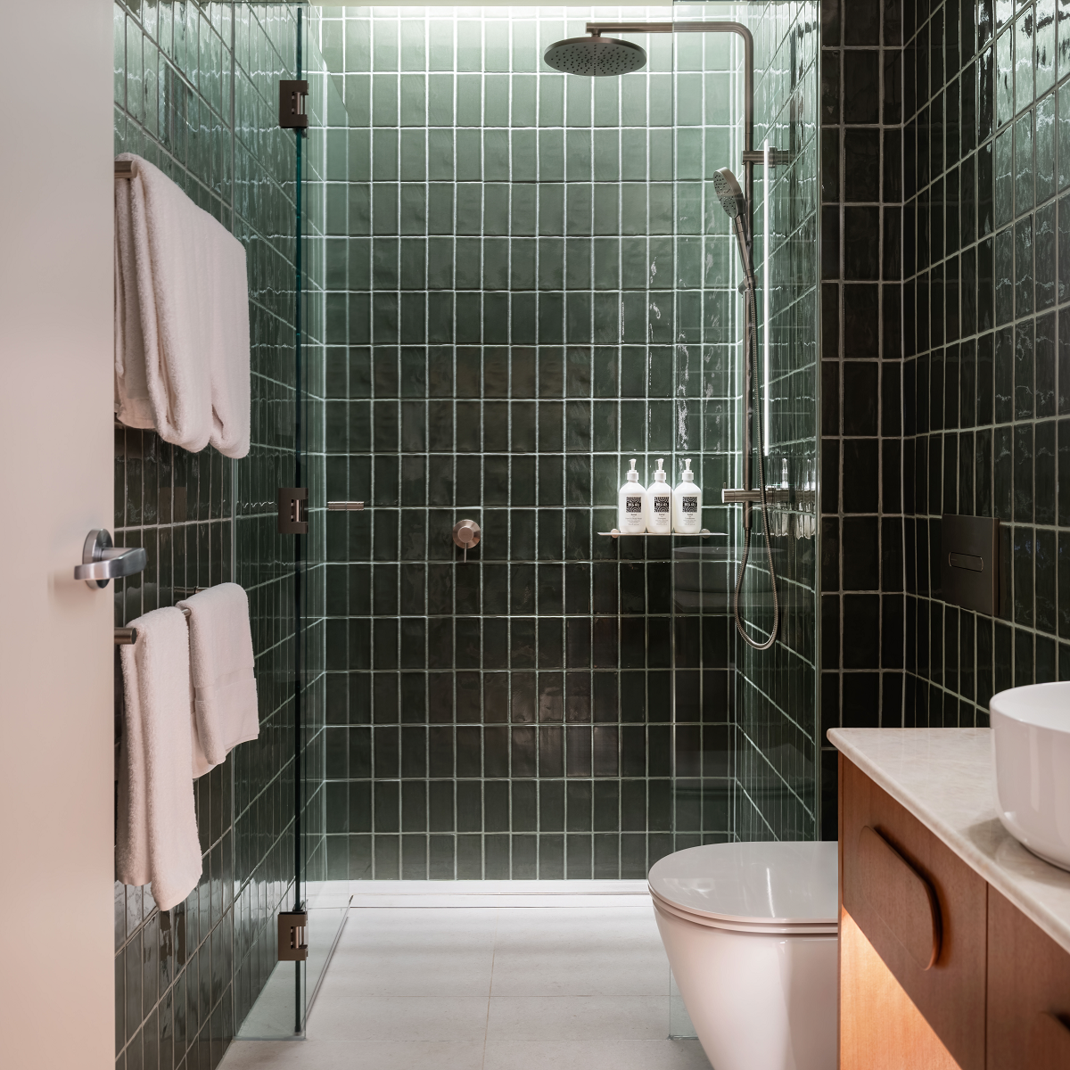 green tiled bathroom in Adina Hobart