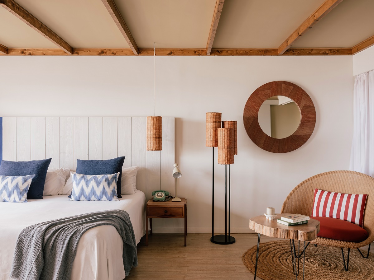 bedroom zel Fuerteventura with red striped cushion and rattan lampshades