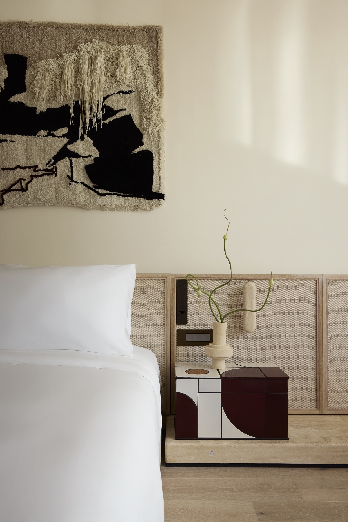 bedroom detail with tapestry above the bed Morea House