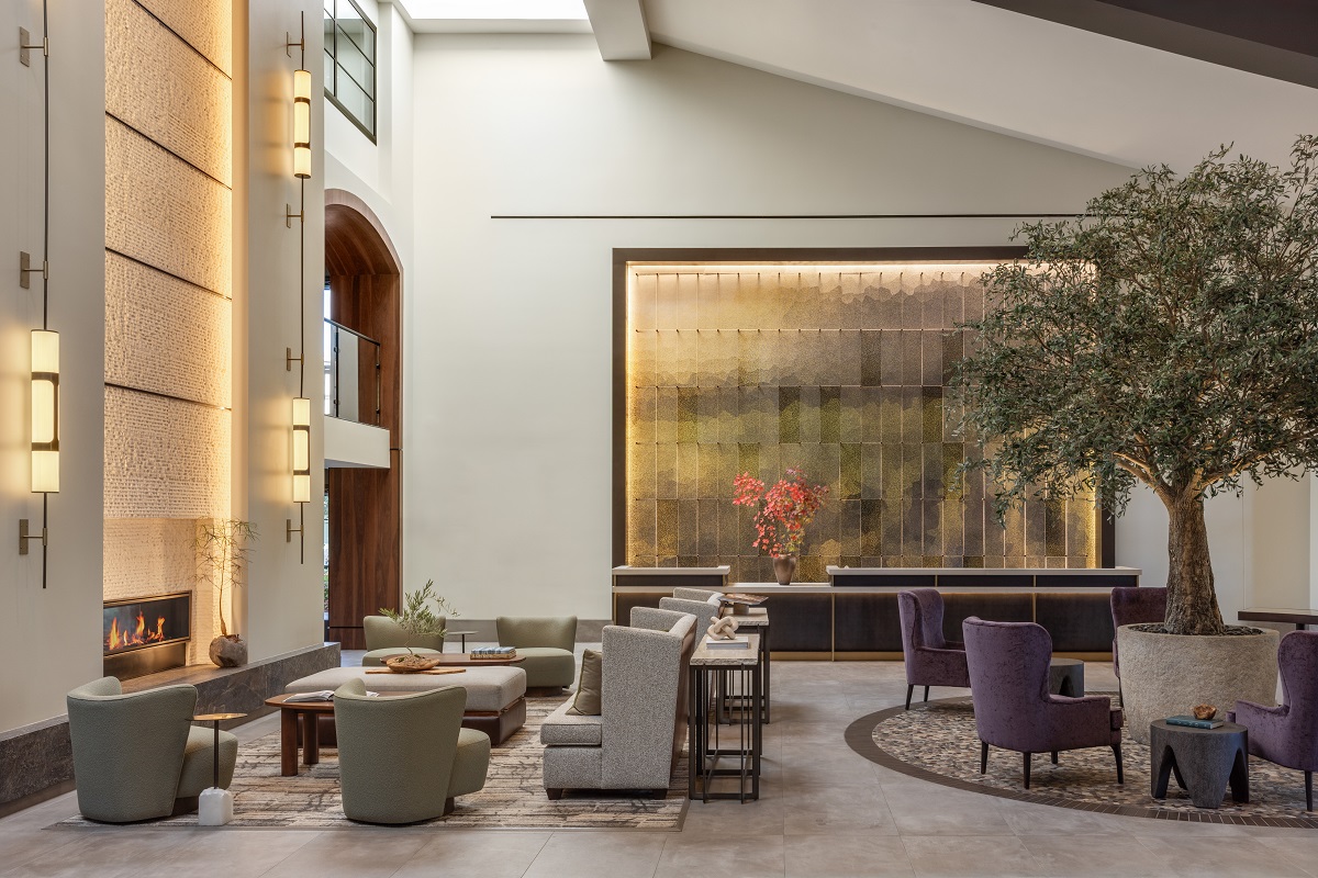 high volume ceiling in lobby of Casa Mani with tree in centre