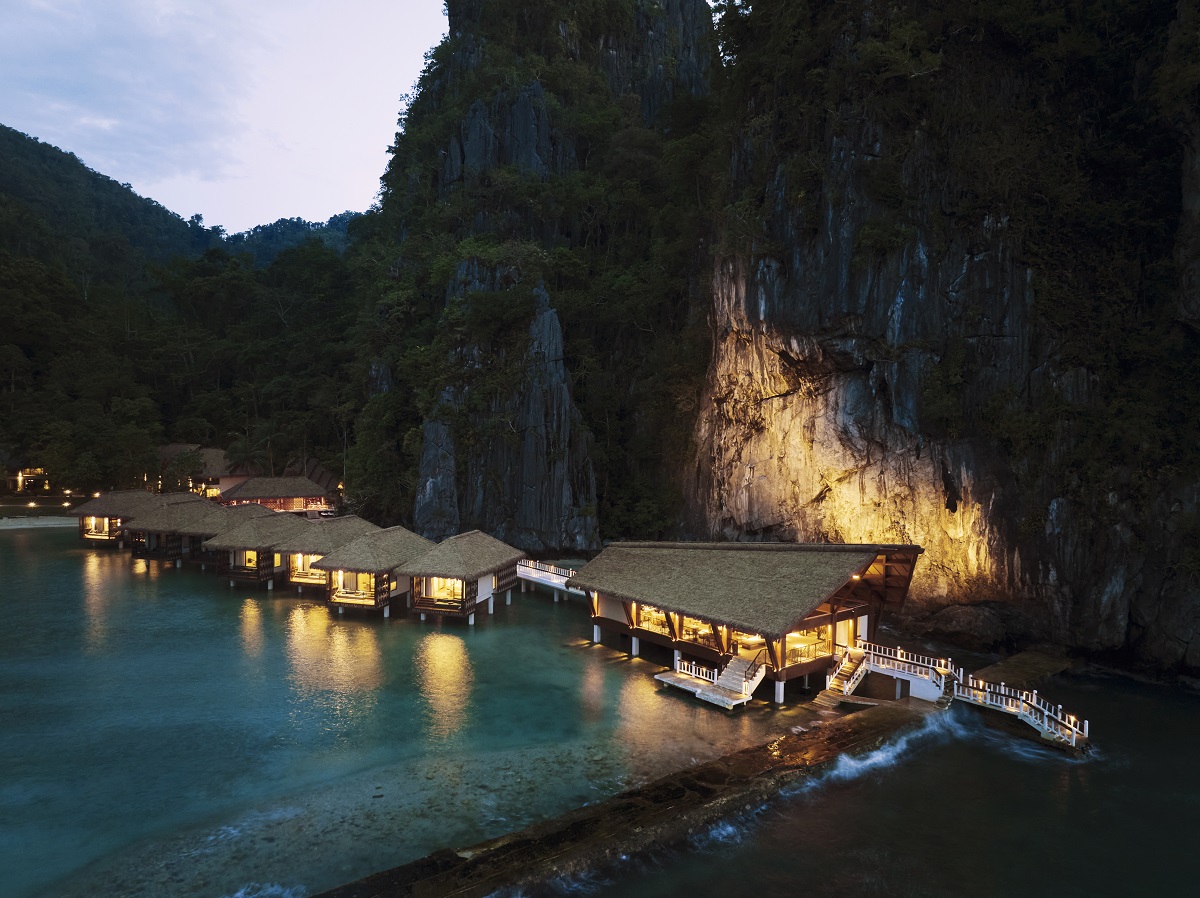 aerial view of beach and over water bungalows Lagen Island Resort, El Nido
