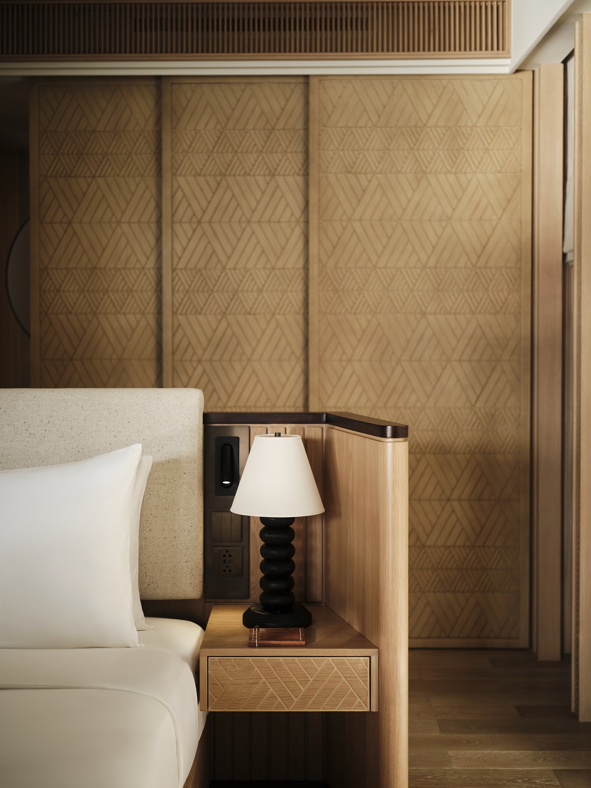 detail of bed and wood panelling in Lagen Island Resort, El Nido water villa
