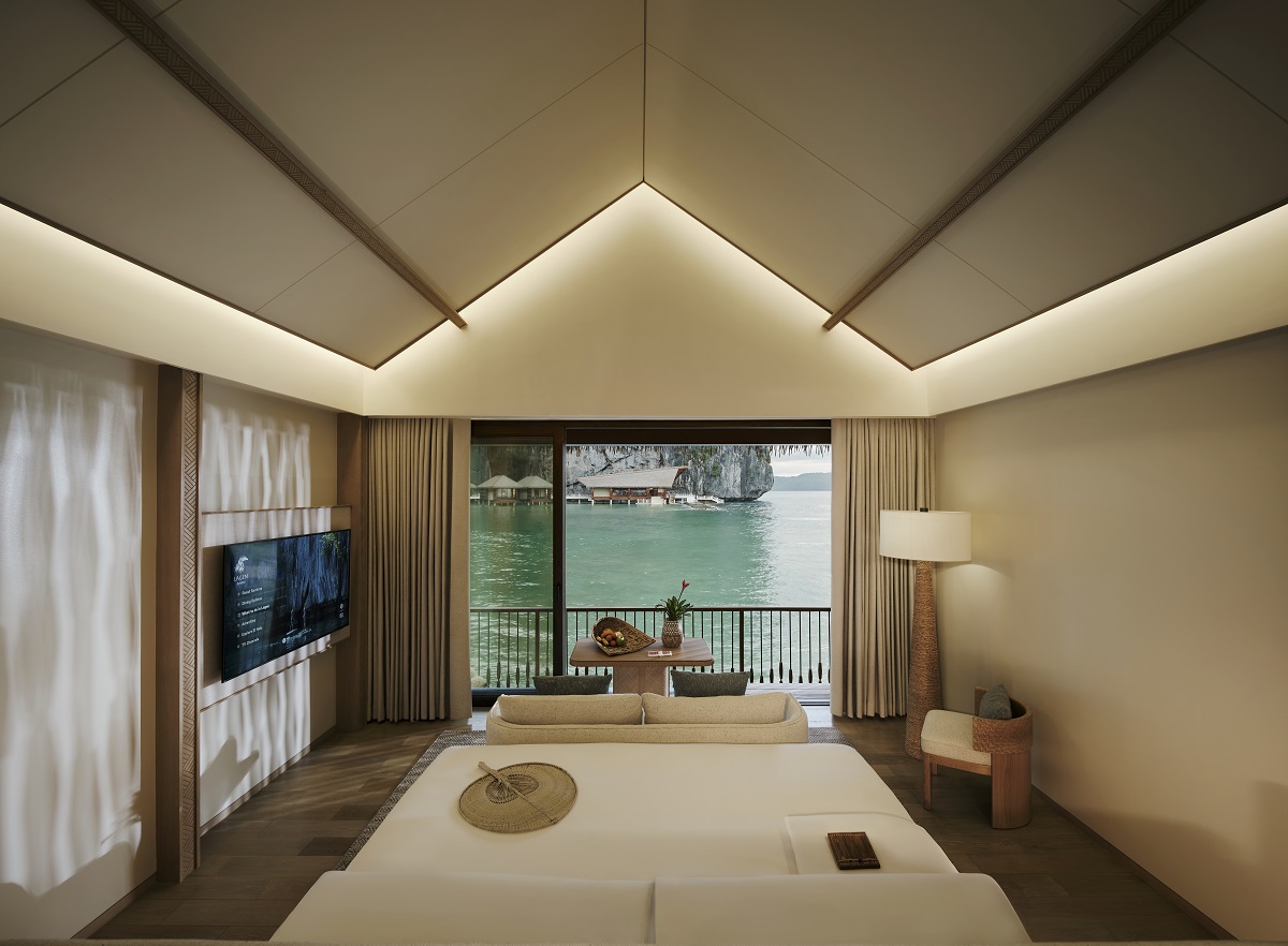 Lagen Island Resort, El Nido water villa interior with view from bed to water