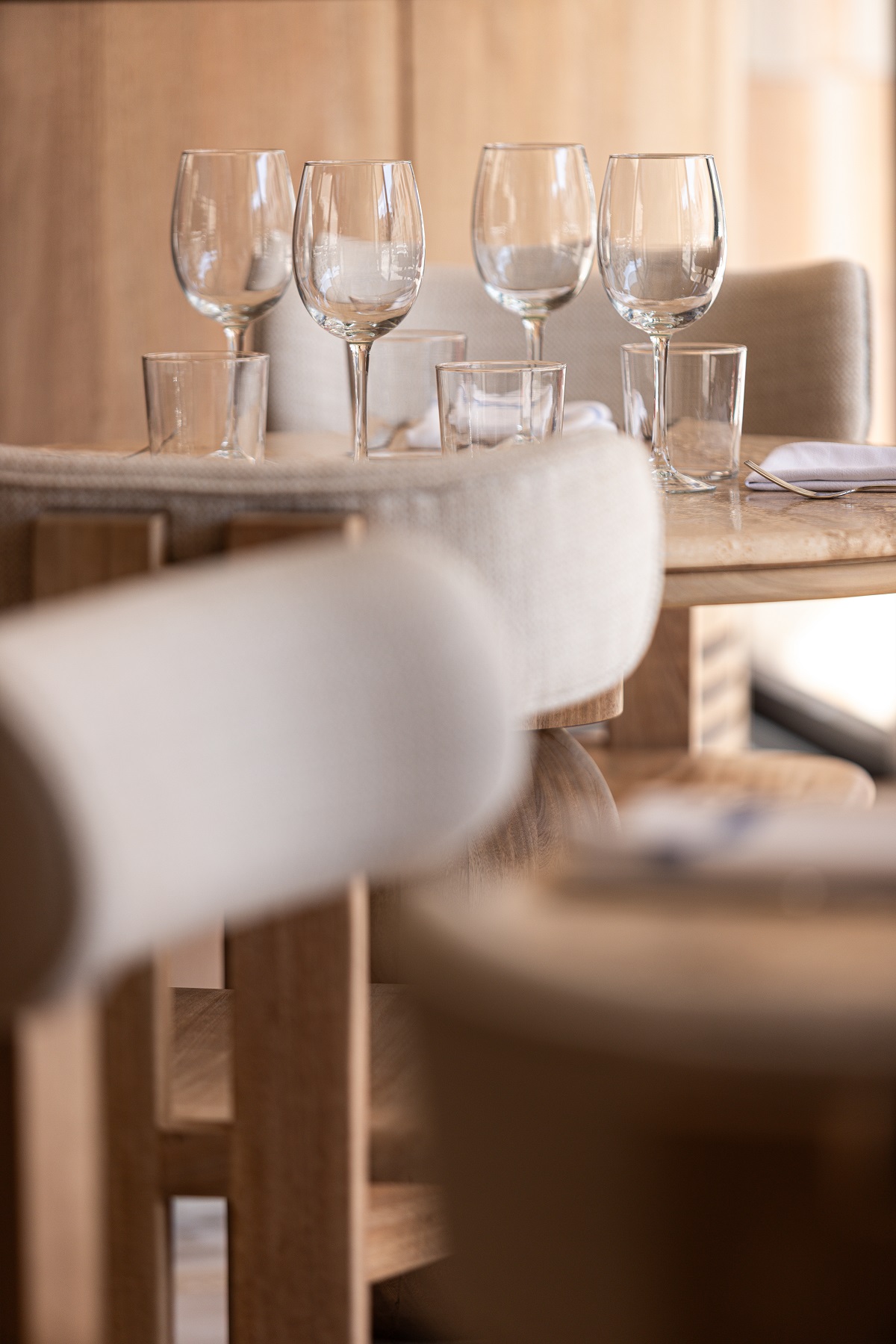 glasses, table setting and furniture detail in restaurant