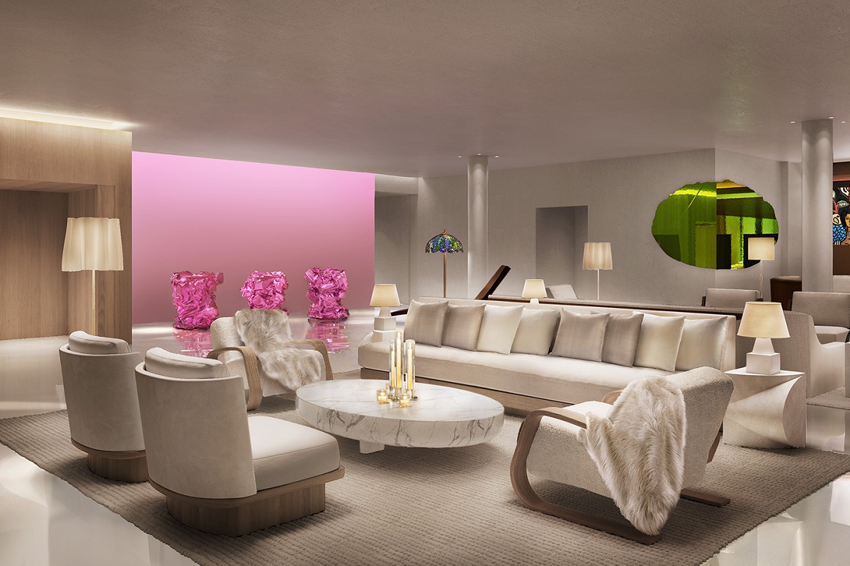 pink wall and installation alongside white furniture in hotel lobby