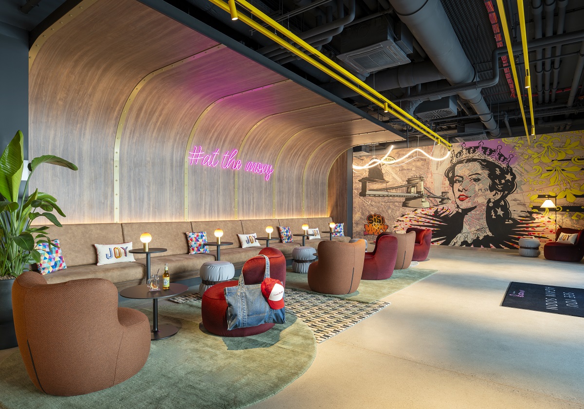 Moxy Budapest downtown lobby seating area with graffiti 