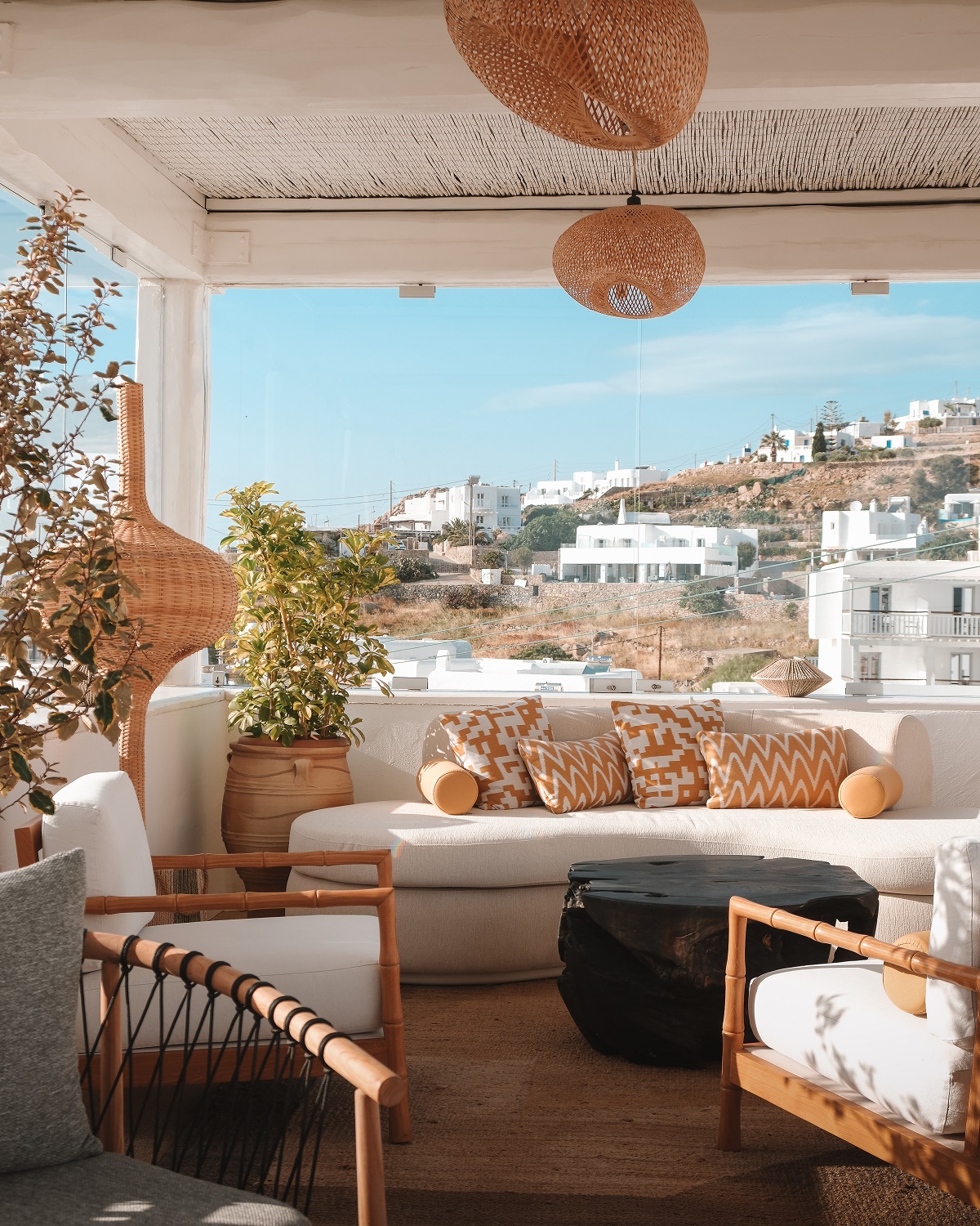 seating on roof terrace with views over Mykonos