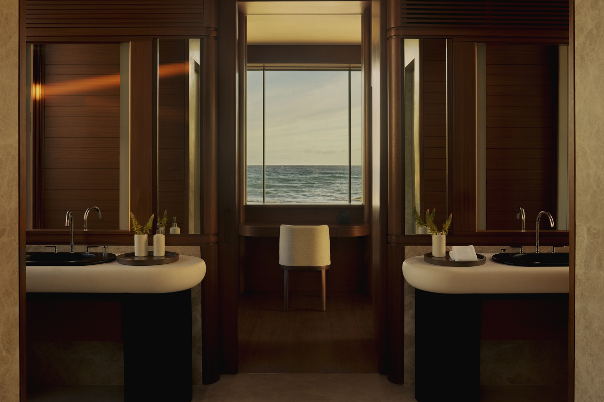 double vanity on either side of window with sea view at Amanvari