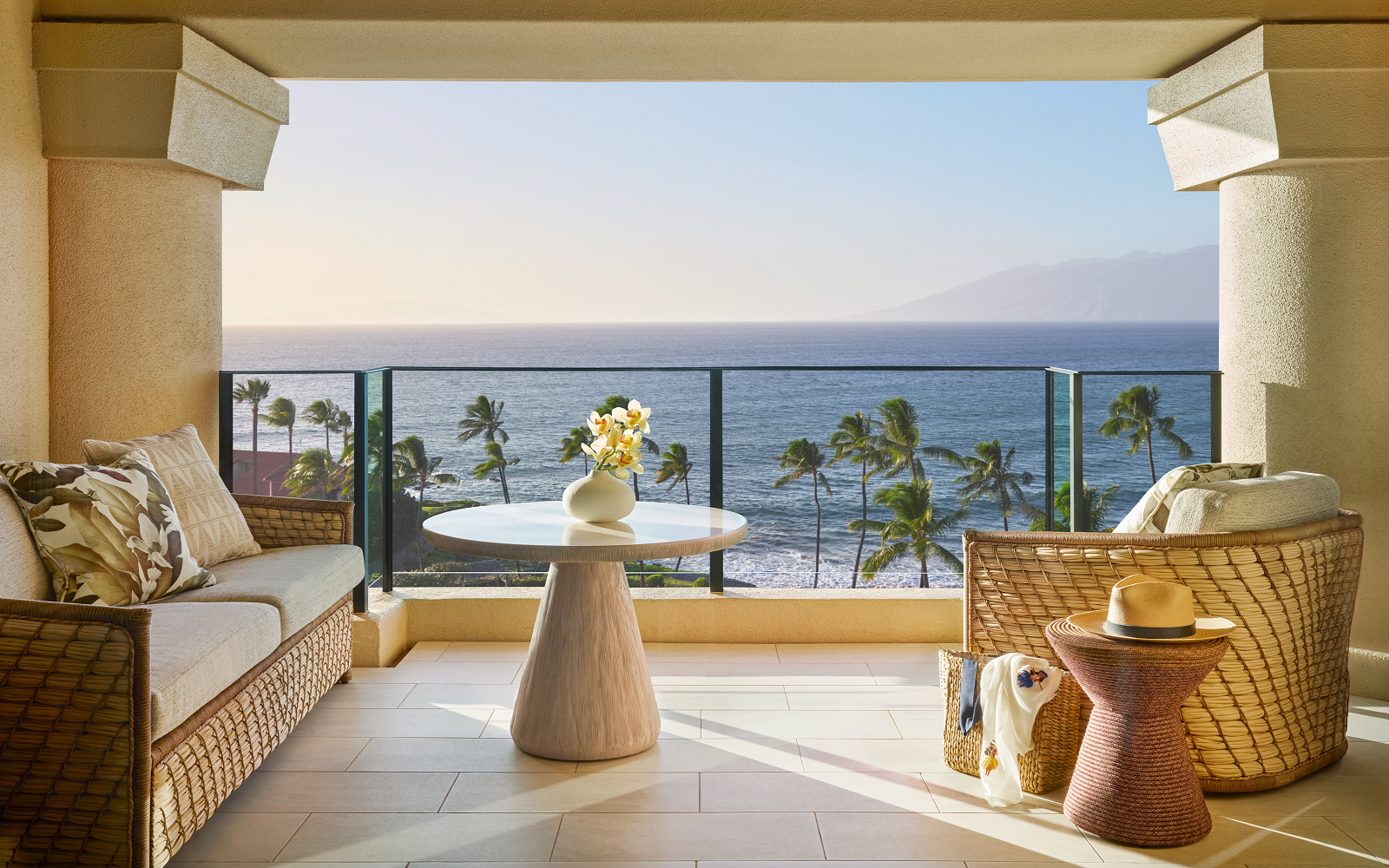 seats on verandah overlooking the ocean at Four Seasons Resort Maui at Wailea debuts the Club Floor,