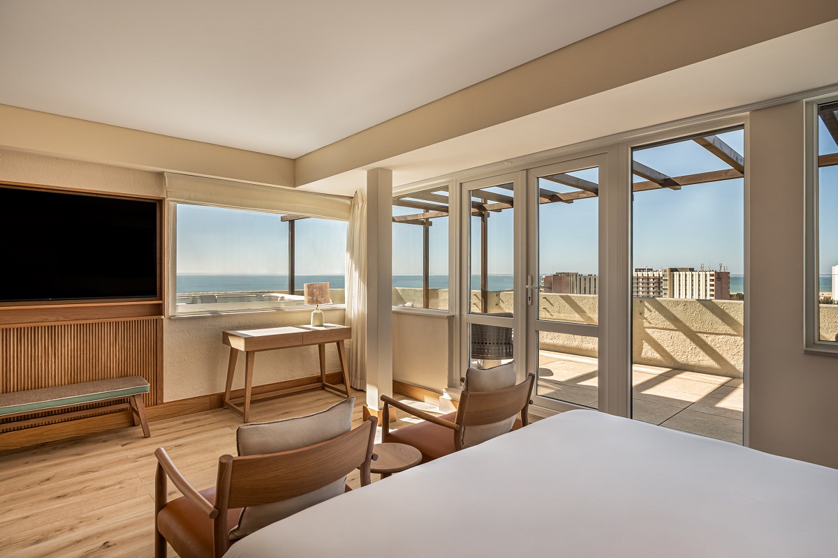 view from bed onto balcony and sea