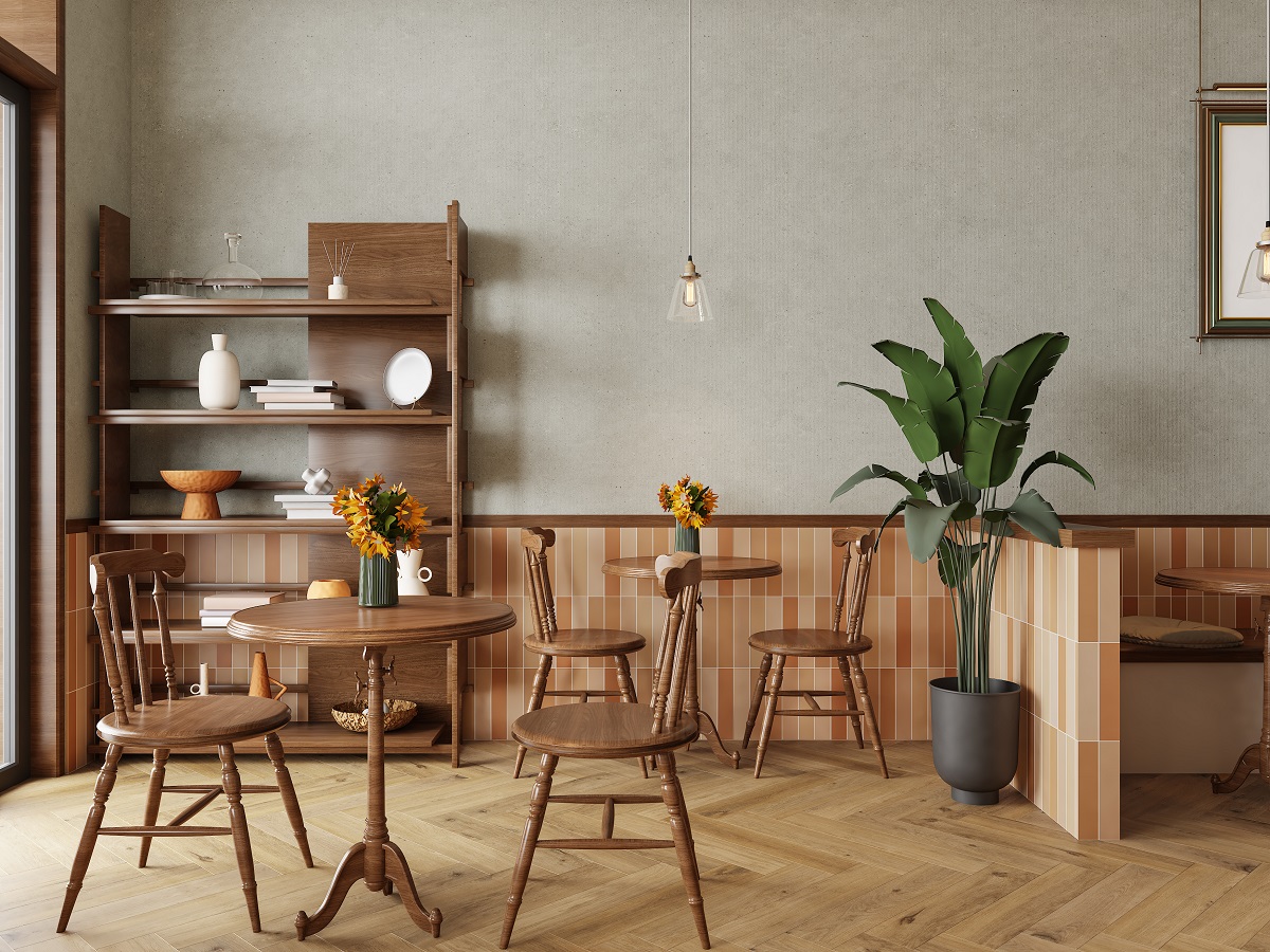wooden chairs and table in restaurant setting with wooden floor and wall panelling