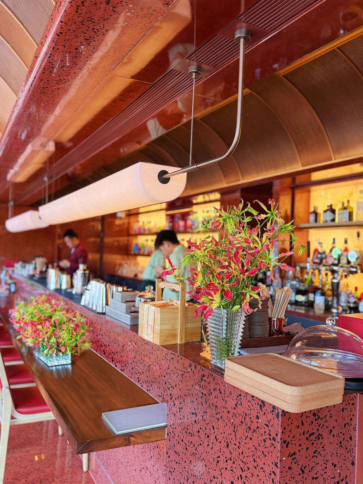 Chayan@5TH, a secluded tea-and-coffee lounge defined by warm lighting, timber screening and tactile materials,
