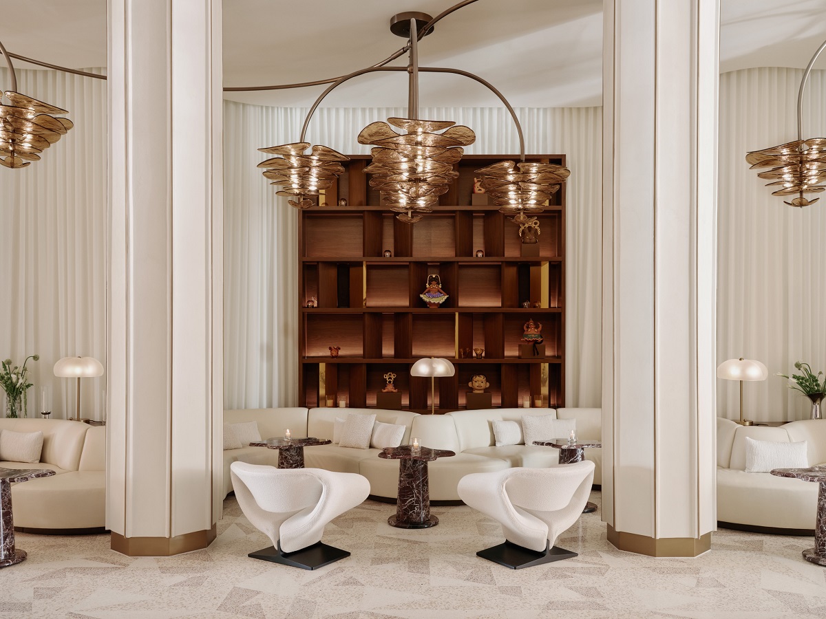 white interior with statement chandelier in Delano lobby