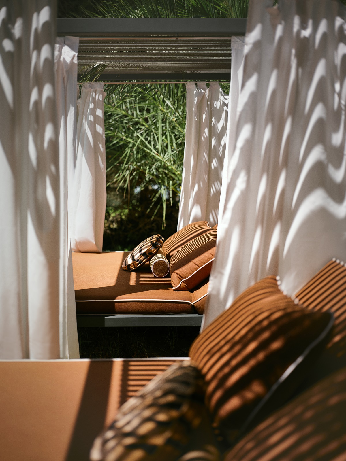 sun and shade in cabanas by pool