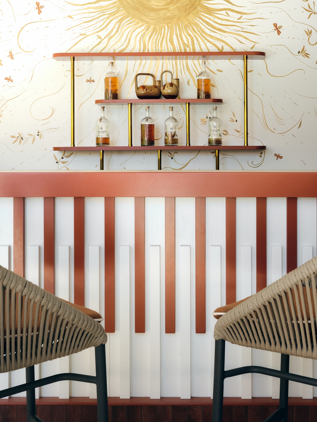 chair and panelling detail with bee motif on walls