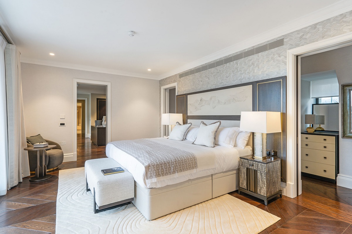 bedroom in cream and white with wooden floor Cheval Residences Knightsbridge