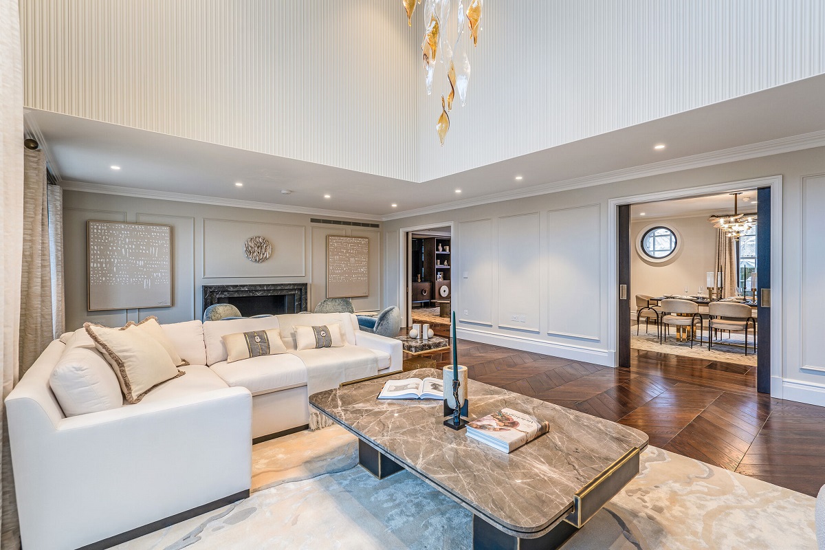 cream couch, marble table, glass chandelier in Cheval Residences Knightsbridge