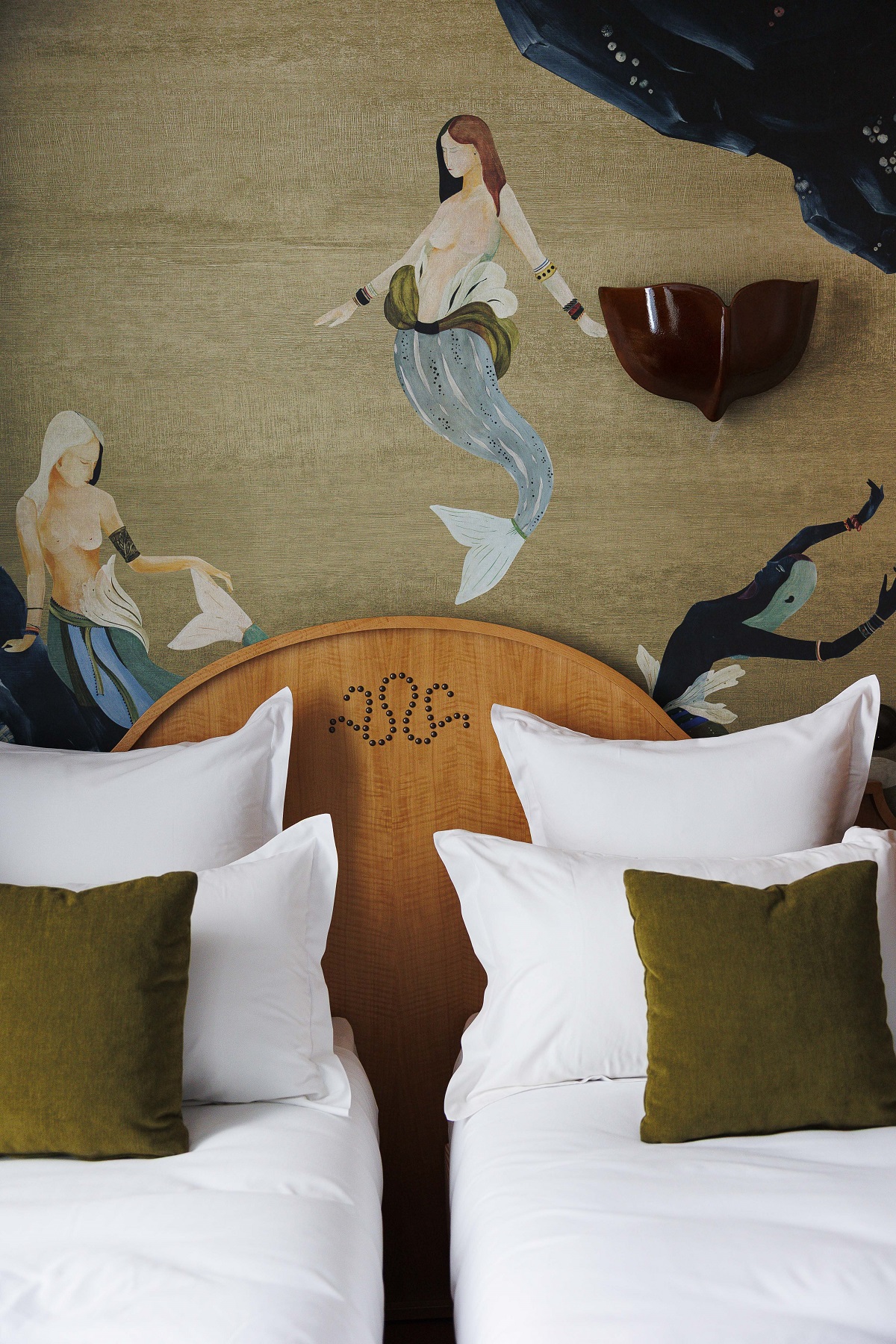 headboard and mermaid mural detail above bed in babel lille