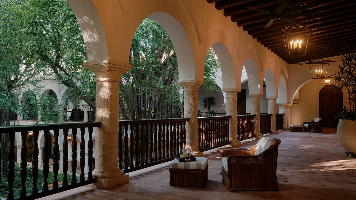 wide shaded terrace with arches overlooking the garden
