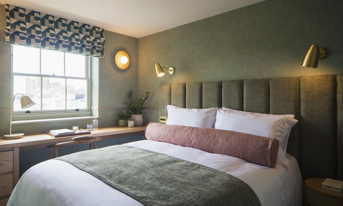 sage green walls and bedhead in guestroom Regency Square Suites _ Suite 5_