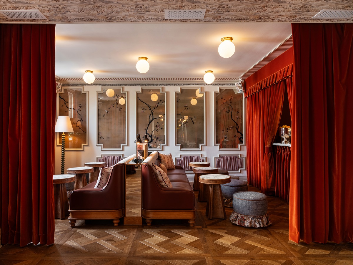 theatrical red curtains and leather chairs in Beverly Hills hotel