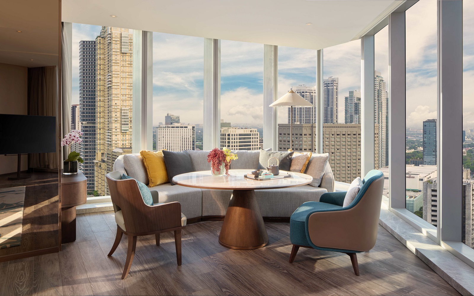 Manila city skyline from the Junior Suite Living and Dining area at Mandari