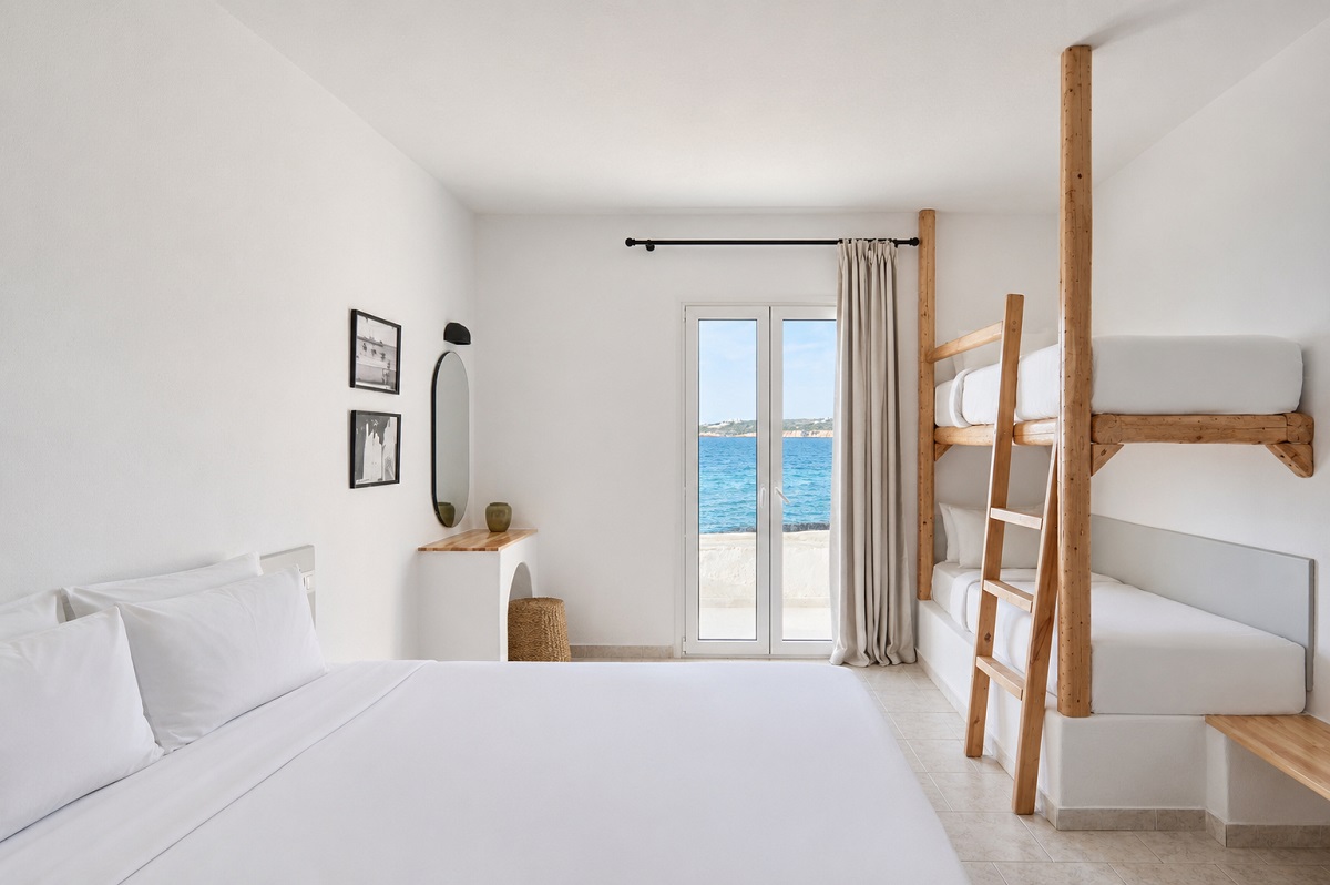 white Greek island guestroom aesthetic with bunkbedsPounda Resort Paros, a member of Radisson Individuals_Family Room 1
