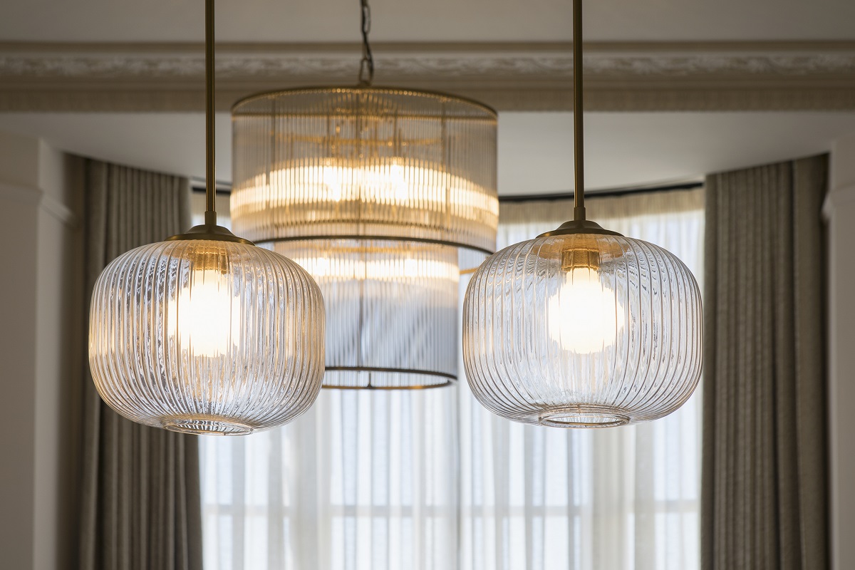 a collection of 3 vintage style glass ceiling lampshadesRegency Square Suites _