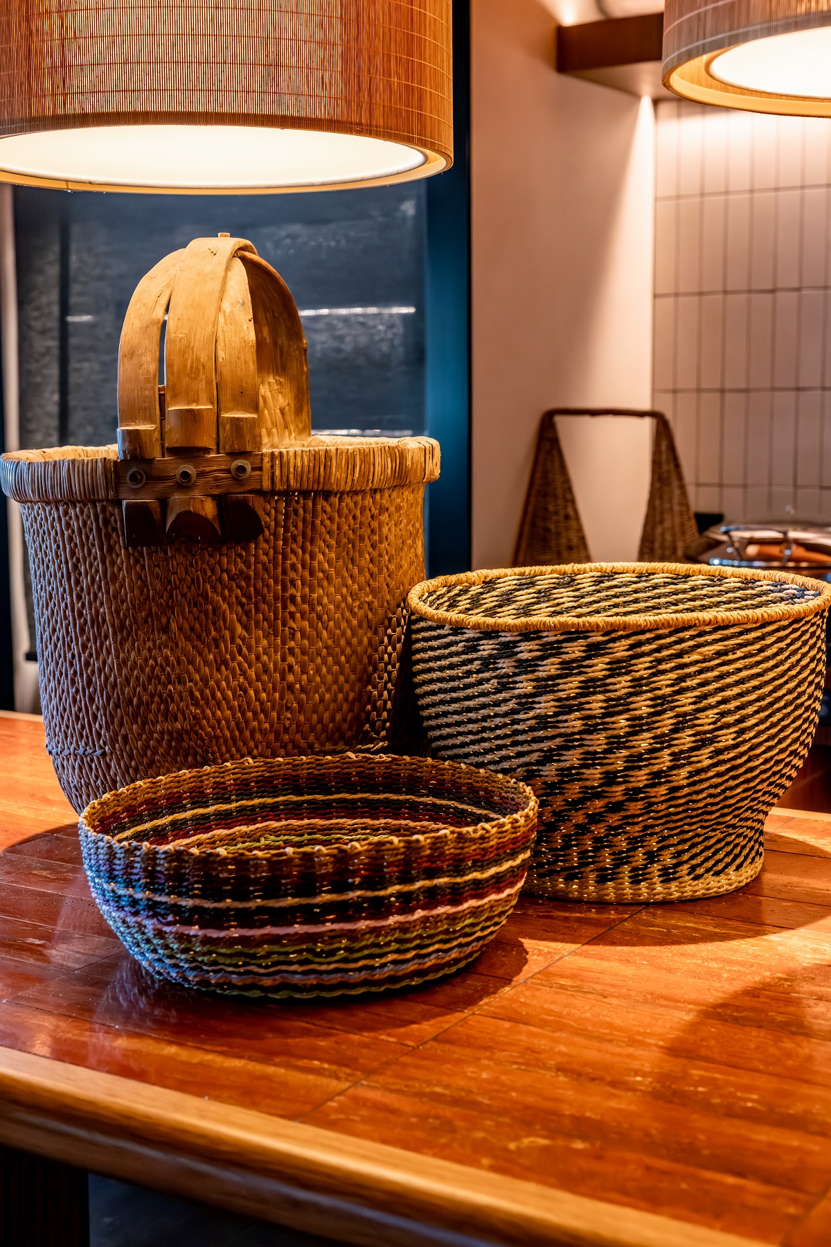 collection of handwoven baskets on counter in Salted Egg Darwin