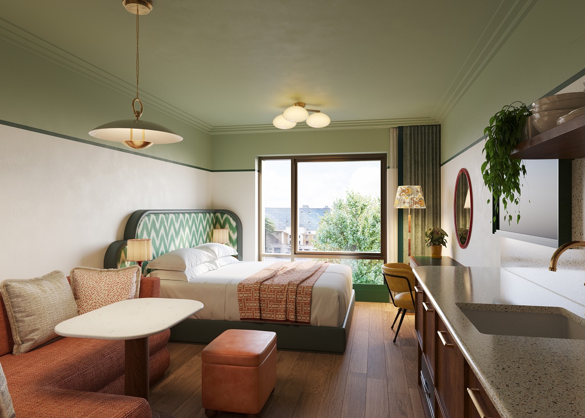 guestroom with seating and kitchen space