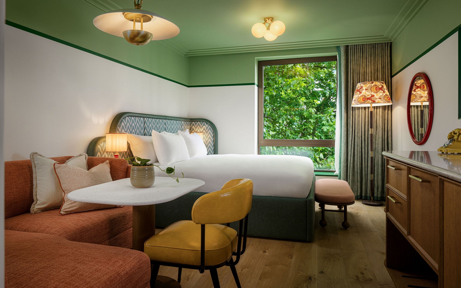 green ceiling and white wall and green headboard in the July with hypnos mattress