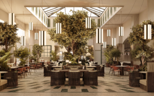 central double volume atrium and dining space with tree in the middle - CORI Hornbæk Hotel