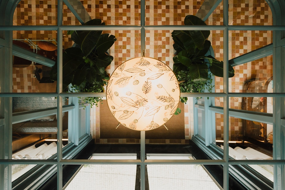 light and mirrored ceiling refelcting tiles seen from below