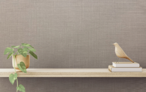 muraspec wallcovering behind wooden shelf with plant and wooden bird