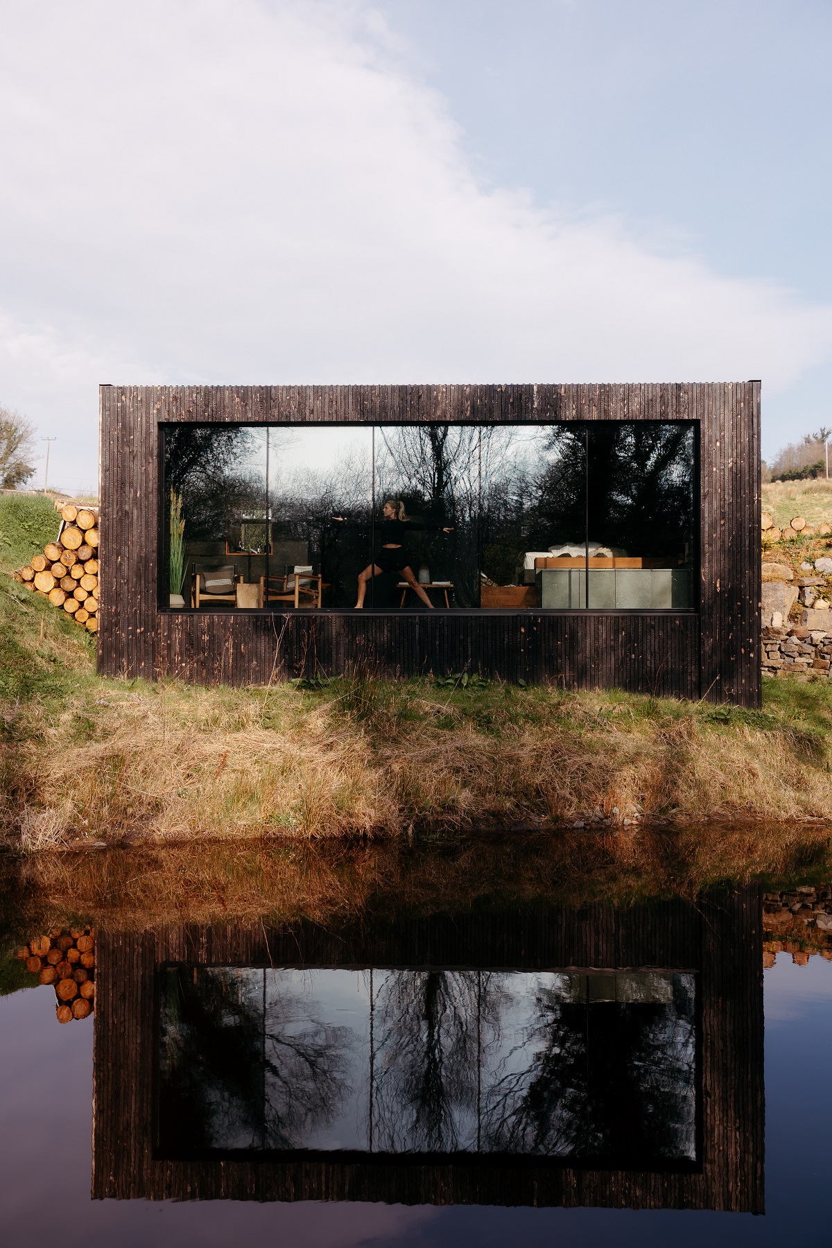 Riverside Cabins offer a more secluded escape, complete with outdoor baths that frame the surrounding landscape,