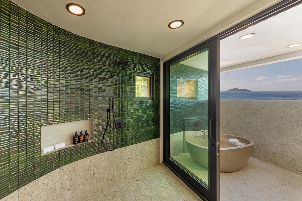 curved shower wall facing glass doors onto terrace