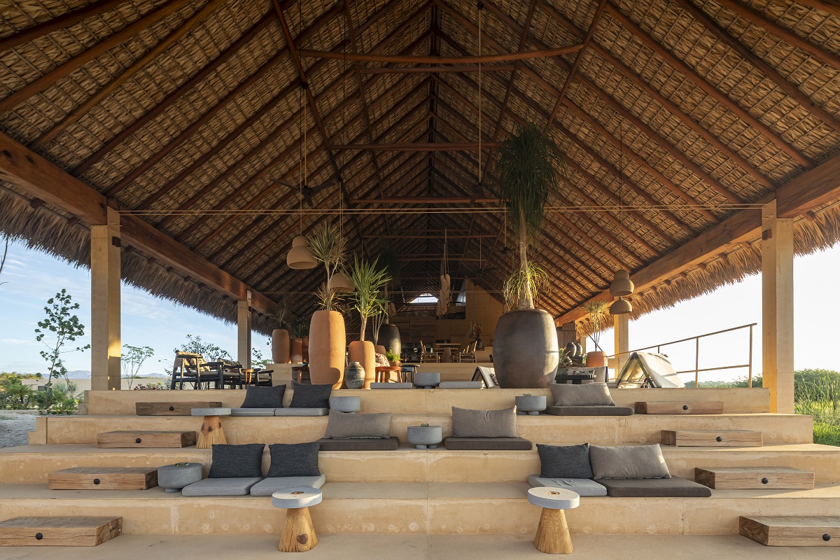 open air restaurant at Kymaia with stepped seating and clay surfaces