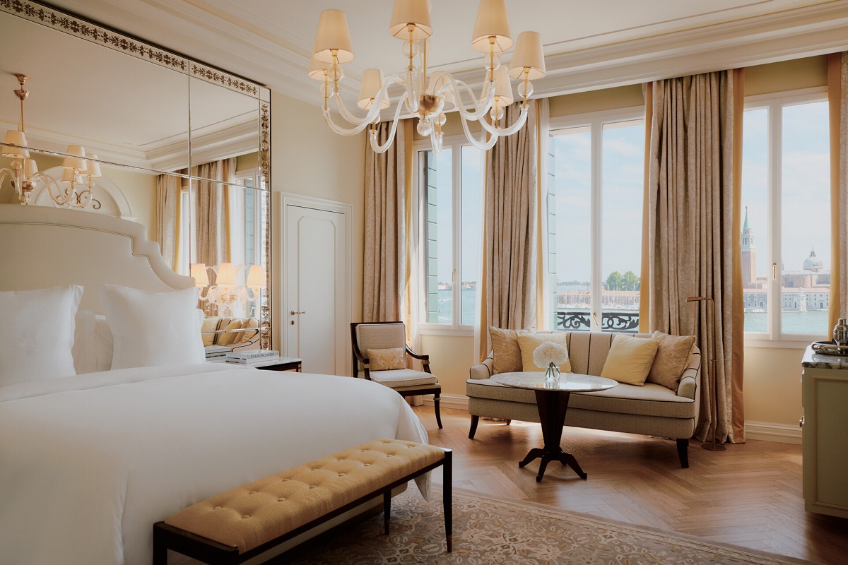 double bed set aginst mirrored wall refelction the view over Venice - Danieli, Venezia, A Four Seasons Hotel 